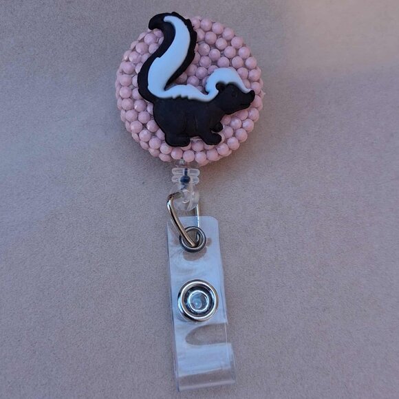 Skunk Badge Reel - Picture 1 of 2